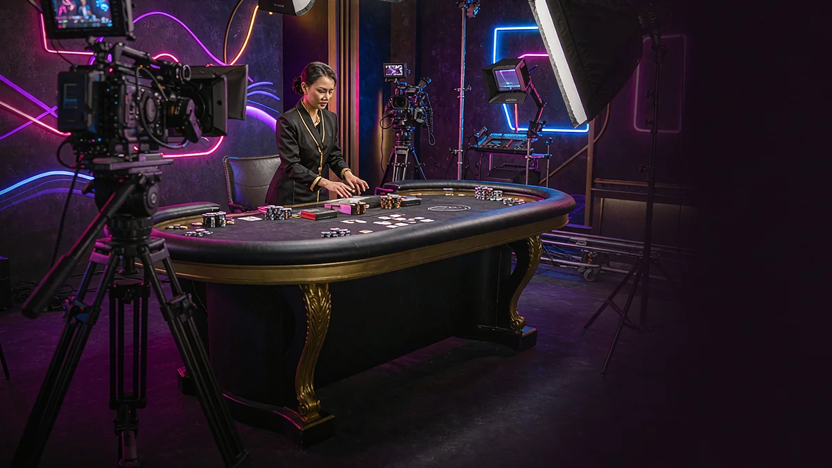A casino table with an adult dealer, cameras and studio lighting — BK33 guide